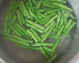 A picture of step 2 of French beans tossed with nuts and feta cheese salad.