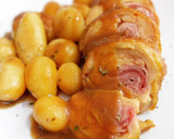Foto del paso 15 de la receta: Muslitos rellenos en salsa de Oporto con patatas