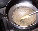 A picture of step 1 of Moong fali Til Ladoo.