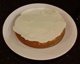 A picture of step 21 of Toasted Butter Pecan Layer Cake with Whipped White Chocolate Cream.
