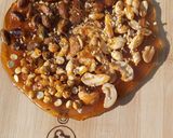 A picture of step 11 of Mixed nuts chikki pizza (chizza).