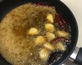 A picture of step 2 of Garlicky Raw Mango thokku /pickle.