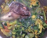 A picture of step 7 of Dinengdeng with fried fish.