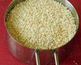 A picture of step 1 of Ellu satham (ellorai in Tamil)-Rice cooked with sesame seed masala powder.