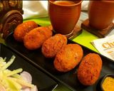 A picture of step 8 of Kolkatas famous beetroot chop.