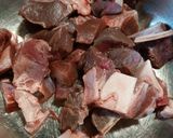 A picture of step 1 of Stewed Goat Meat with Pigtails.