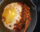 A picture of step 4 of Paratha kebabs wrap with egg.