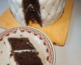 A picture of step 9 of Chocolate with ground nuts cake covered in fondant.