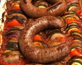 A picture of step 9 of Farm shop wild boar and venison sausages on ratatouille.