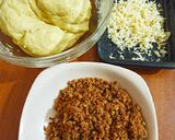 A picture of step 2 of Minced meat and cheese stuffed buns.