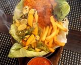 A picture of step 9 of Paneer Shashkik Sizzler with Schezwan Corn Rice.