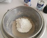 A picture of step 3 of Blueberries and vanilla frosted cup cakes.