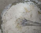 A picture of step 3 of Eggless mawa cup cake topping with shrikhand.