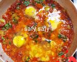 A picture of step 6 of Shakshuka with Eggs and Pastrami.