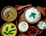 A picture of step 22 of Tamilnadu Thali - rice, sambar, mor kuzhambu, beetroot poriyal, payasam, buttermilk for lunch.