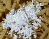 A picture of step 2 of Thelay walay french fries with illaichi wali chai.