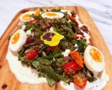 A picture of step 8 of Kinda Nicoise with Fried Green Beans, Roasted Kale, Lentils, Boiled Eggs and Caper Mayo.