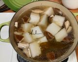 A picture of step 4 of Chicken Soup with Pickled Chili Peppers and Winter Melon.