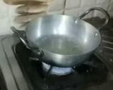 A picture of step 13 of Ashtami special prasaad the puri chana and halwa thali.