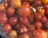 A picture of step 2 of Cherry tomato pickle.