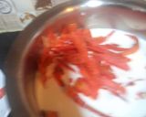 A picture of step 3 of Gajar ka halwa with peels.