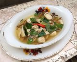 A picture of step 4 of Clear Tom Yum Soup with Three Mushrooms (Vegetarian).