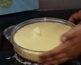 A picture of step 3 of No churn mango ice cream.