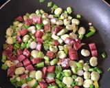 A picture of step 2 of Basque sausage, goats cheese, broad bean and spring onion salad.