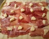 A picture of step 2 of Speck and brie pastry bites.