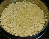 A picture of step 2 of Upma with puffed rice and colorful veggies.