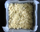 A picture of step 2 of Jam Coconut Slice.
