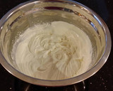 A picture of step 11 of Vanilla Lemon Raspberry Layer Cake with Whipped Cream Buttercream Frosting.