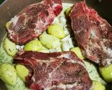A picture of step 5 of Pork Chops with Honey, Soy Sauce, Mustard, and Lemon Baby Potatoes in a Dutch Oven.