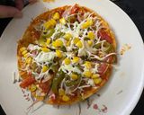 A picture of step 6 of Chapati cheese burst pizza rotzza.