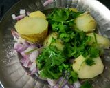 A picture of step 2 of Aloo bathe aloo choka and aloo pithika.