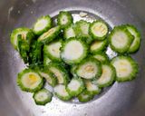 A picture of step 1 of Karela Subzi (Bitter Gourd).