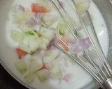 A picture of step 3 of Onion Cucumber Tomato Raita.