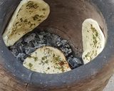 A picture of step 4 of Kadhai paneer with garlic naan.