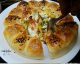 A picture of step 8 of Bubble pizza.