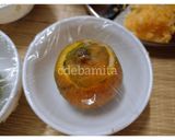 A picture of step 3 of Orange Kulfi in orange shell.