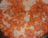 A picture of step 1 of White rice sprinkled with carrot,Chicken stew and veggies.
