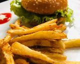 A picture of step 5 of Chicken shami burger with crunchy fries 😋👌.
