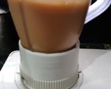 A picture of step 2 of Mango smoothie with lemon.