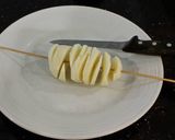 A picture of step 4 of Tornado Potatoes.