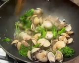 A picture of step 7 of Pan fried sea bream with sake braised clams and broccolini.
