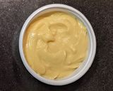 A picture of step 1 of Moong and Chana Hummus on toasted bread.