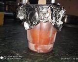 A picture of step 3 of Orange popsicle sticks.