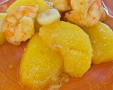 Foto del paso 8 de la receta Patatas confitadas al aroma de langostinos al ajillo