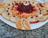 A picture of step 6 of Strawberry jello with fruits.