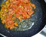 A picture of step 2 of Kathiyawadi Sev Tomato sabzi.